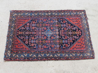 A blue and red ground Malayer rug with central medallion 152cm x 106cm 