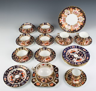 A Royal Crown Derby Imari pattern coffee can, saucer and plate, 6 tea cups and saucers, a pair of tea cups and saucers, a tea cup, 4 medium plates, 2 small plates, a sandwich plate 