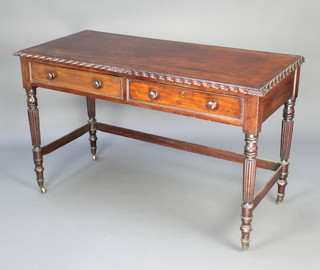 A 19th Century Chippendale style mahogany writing table with gadrooned border, fitted 2 frieze drawers and raised on turned and reeded supports 80cm h x 134cm w x 60cm d 