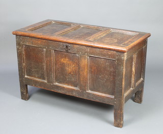 An 18th Century oak coffer of panelled construction with hinged lid 67cm h x 108cm w x 56cm d 