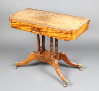 A Regency bleached mahogany card table, crossbanded rosewood and with brass stringing, raised on 4 turned columns, triform base and splayed feet ending in brass caps and castors 73cm h x 95cm w x 47cm d 