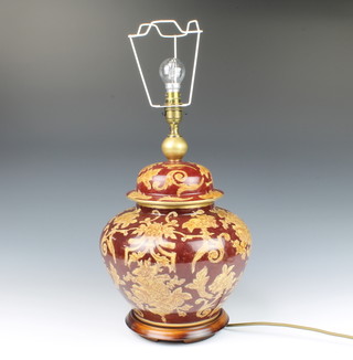 A Chinese style pottery table lamp in the form of a lidded urn 32cm h x 24cm diam
