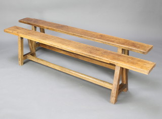 A pair of oak trestle benches 42cm h x 192cm l x 20cm d 