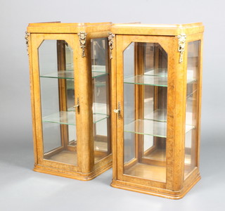 A pair of Victorian figured walnut and gilt metal mounted pedestal display cabinets, fitted shelves enclosed by lead glazed panelled doors 93cm h x 41cm d x 35cm d 