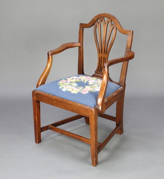 A Hepplewhite style mahogany carver chair with upholstered drop in seat raised on square supports