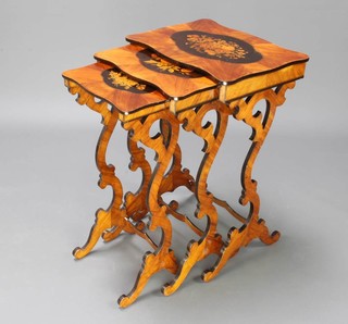 A nest of 3 19th Century French inlaid Kingwood interfitting coffee tables of serpentine outline, the tops inlaid floral panels and raised on pierced supports 70cm h x 47cm w x 35cm d, 69cm x 40cm x 30cm and 67cm x 33cm x 26cm 