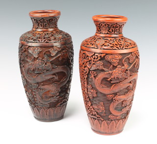 A pair of 20th Century earthenware cinnabar lacquer style oviform vases decorated with dragons 23cm h 