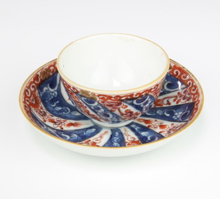 An 18th Century Chinese Imari tea bowl and saucer decorated with flowers 