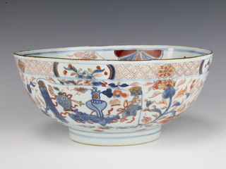An 18th century imari bowl decorated with flowers and motifs 23cm diam. 