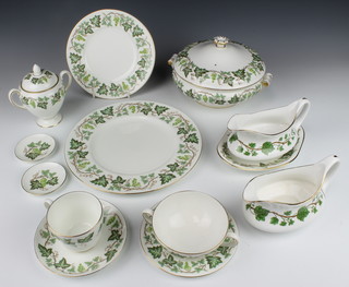 A Wedgwood Santa Clara part tea and dinner service comprising 12 tea cups, 13 saucers, 12 small plates, 5 medium plates, 11 dinner plates, a tureen and lid, a tureen, a sauce boat and stand, a rectangular box and cover, 2 small dishes, 3 shallow bowls, a lidded sugar bowl, an oval serving dish, 3 soup bowls, a sauce boat and 11 plates 
