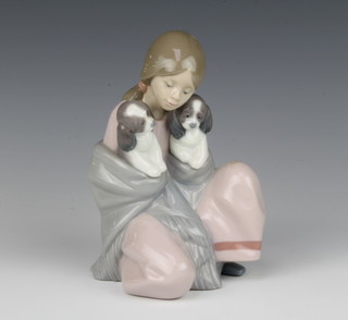 A Lladro figure of a seated girl with 2 puppies in her shawl 6226 16cm 