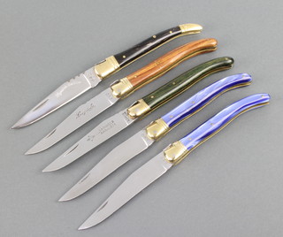 A collection of 5 late 20th Century Laguiole knives, each knife with mirror finished blade and decorated back spring with traditional bee, 3 are in unused and mint condition 