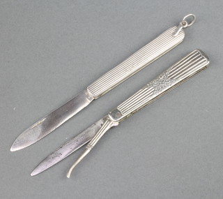 Two American Art Nouveau white metal fruit knives, one knife with steel blade and seed pick, the other stamped LK 800  