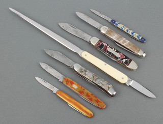 Six pen/pocket knives with decorative grips, 2 of the knives American and stamped Imperial, 1 knife with marble effect and coin silver and a letter opener with knife blade 