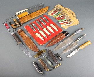 A collection of advertising and other knives including multi-bladed knives, Canary Islands banana knives and a Sheath knife
