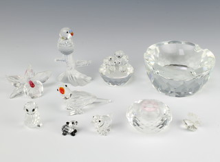 A Swarovski Crystal squat vase 3.5cm, a do. parrot 7cm, a panda cub 1.5cm and 7 other crystal ornaments 