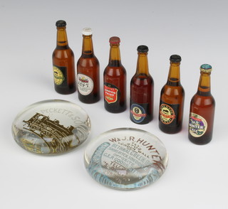Six miniature bottles of beer 3.75cm, 2 advertising paperweights - Peckett & Sons locomotive engineers Bristol 8cm and W & J R Hunter mahogany and timber merchants 8cm 