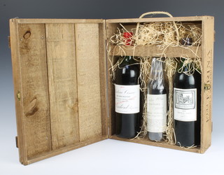 A bottle of 1970 Berry Bros. Chateau Gazin, a bottle of 1971 Chateau Cissac Cru Bourgeois Medoc and a bottle of 1979 Ruster Trockenbeeren contained in a wooden presentation case 