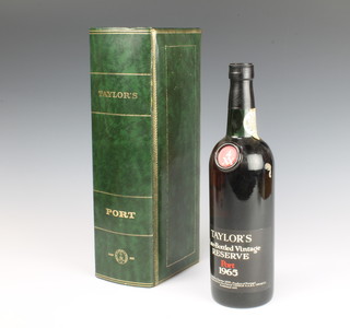 A bottle of 1965 Taylors late bottled vintage reserve port contained in a leather presentation box 