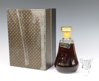 A 1970's bottle of Bisquit Fine Champagne Napoleon Cognac contained in a Baccarat decanter, in presentation box 