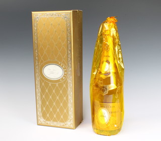 A bottle of 1996 Marque Deposee Louis Roederer Cristal Champagne in presentation box 