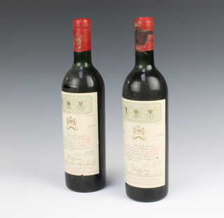 Two bottles of 1964 Chateau Mouton Rothschild  numbered 124419 and 124409 