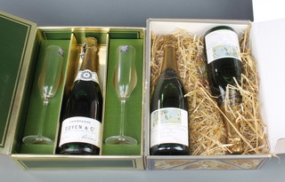 A bottle of 1975 Doyen & Company champagne contained in a Harrods box together with 2 champagne flutes and 2 bottles of 1975 champagne Bruno Paillard Reims-France blanc de blancs in a presentation box
