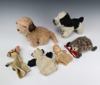 A Merrythought figure of a hedgehog 18cm, a Merrythought figure of a black and white dog 23cm, a Dakin & Co figure of a dog, 2 hand puppets and a Rosebud doll