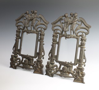 A pair of Victorian pierced cast iron easel photograph frames surmounted by a figure of parents and child 36cm x 22cm, base marked RD618053 