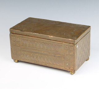 A Newlyn style rectangular copper box with hinged lid raised on bun feet 12cm x 23cm x 13cm (slight dent to top) 