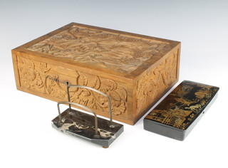 An Art Deco black marble and metal 2 bar letter rack 10cm x 15cm x 8cm, a Chinese rectangular black lacquered paint box with hinged decorated figures 3cm x 23cm x 10cm, a Chinese carved hardwood trinket box with hinged lid decorated a dragon chasing a flaming pearl, labelled Leeyu,  12cm x 36cm x 26cm 