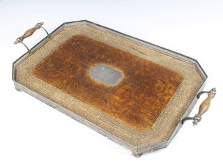 A carved oak lozenge shaped tea tray with silver plated mounts 5cm x 51cm x 34cm 