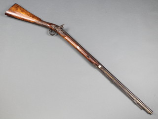 An 18th/19th Century muzzle loading Percussion lock sporting gun with 82cm barrel and ram rod, the stock with cheek piece marked 648