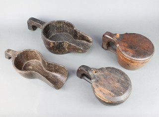 Two Indian shaped wooden rice scoops 10cm x 45cm x 19cm and 9cm x 36cm x 50cm together with 2 do. lidded rice cups 10cm x 18cm and 10cm x 16cm (the smaller has damage and repair) 