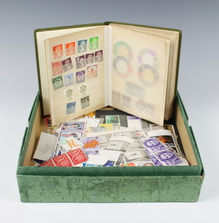 A stock book of George VI and Elizabeth II stamps and a collection of loose Elizabeth II mint GB stamps  