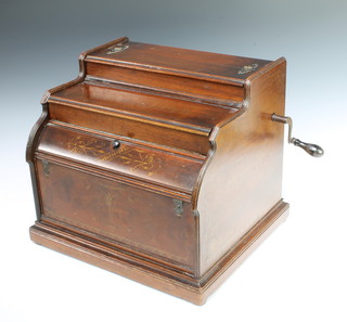 An American Celestina music hand wound organette, the interior marked 2102, together with  6 music rolls