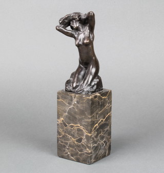A bronze figure of a naked kneeling lady raised on a veined marble base 25cm x 7cm x 6.5cm (chips to base) 