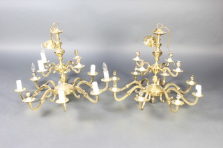 A pair of gilt metal Dutch style 12 light electroliers 