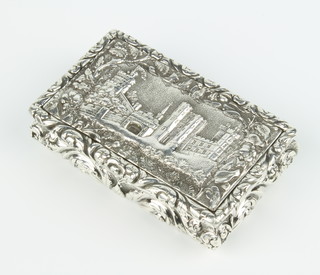A George IV rectangular silver snuff box decorated with a view of Windsor Castle, the body with pineapple fruits and scrolls, the gilt interior engraved "Presented to James Gentle Esquire by a friend as a token of esteem and regard", Birmingham 1825, maker Thomas Shaw 128 grams 8cm