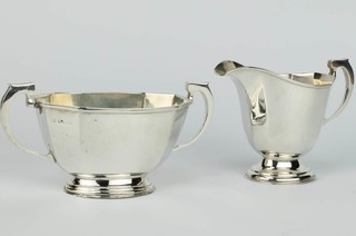 A silver panelled milk jug and sugar basin Birmingham 1933, 380 grams 