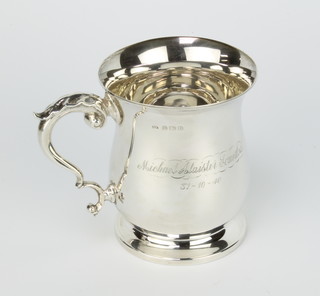 A baluster silver mug with fancy S scroll handle and presentation inscription Birmingham 1938 208 grams 10cm 