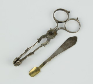 A pair of Georgian silver scissors, sugar nips and a spoon 