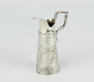 A Continental miniature repousse silver ewer decorated with cavorting cherubs 7cm 