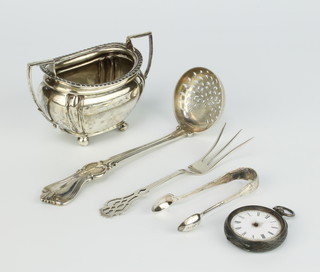 An Edwardian silver sugar bowl on ball feet Birmingham 1903, sifter spoon, nips and fork, 164 grams together with a silver fob watch 