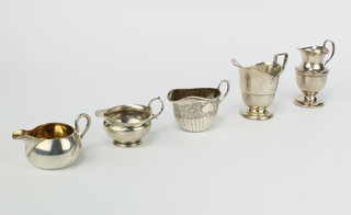 A Victorian silver cream jug Birmingham 1898, 4 others, 281 grams 