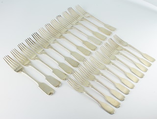 A set of 12 Victorian silver fiddle pattern table forks with chased armorials, different dates and 10 William IV silver dessert forks London 1834/1835, 1316 grams 