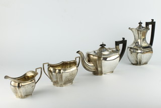 A silver 4 piece octagonal tea set with ebony mounts Birmingham 1928, gross weight 1773 grams 