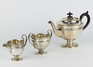 A silver 3 piece tea set of pedestal form with ebony mounts London 1932, 620 grams gross