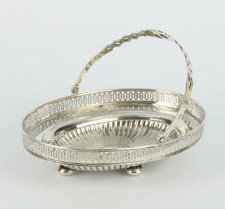 A Continental pierced repousse silver swing handled basket 18cm 184 grams 