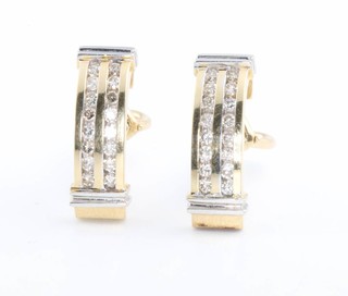 A pair of 14ct yellow gold diamond set ear clips, approx. 0.8ct 
